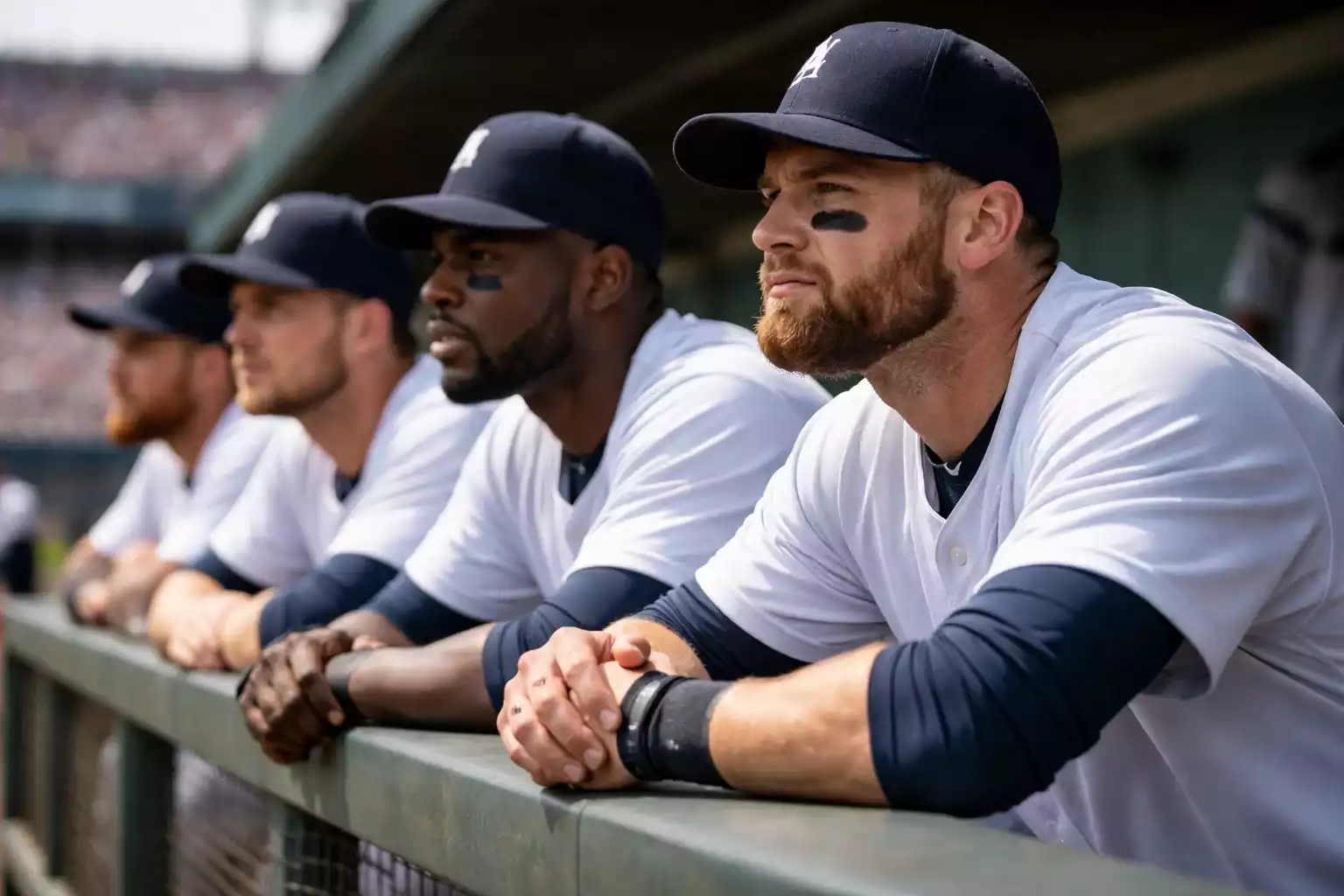 Baseball team dugout with determined players